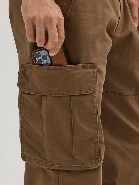 You can take everything with you whenever you wear our Men’s Ripstop Cargo Pant. Made to handle everything the day throws your way, these relaxed fit pants are as tough as they come. They’re crafted from a woven cotton fabric with just a hint of stretch. They feature a straight leg, roomy side pockets with extra compartments for essentials, back pockets, side pockets, a keychain belt loop, as well as a classic zip-fly and button closure. They won’t disappoint. Men's Luxury Utility Cargo Jeans, Midweight Nylon Cargo Pants With Functional Pockets, Relaxed Fit Full-length Cargo Pants With Patch Pockets, Relaxed Fit Military Cargo Jeans With Multiple Pockets, Military Cargo Jeans With Multiple Pockets For Outdoor, Wrangler Pants, Cargo Pant, Cargo Pants Men, Workout Pants