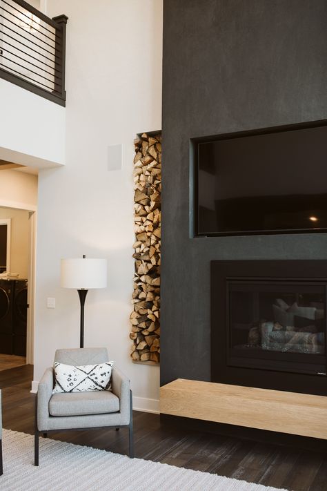 Black Vaulted Fireplace, Black Fireplace Dark Floors, Dark Stucco Fireplace, 2 Story Fireplace Ideas Modern, Black Roman Clay Fireplace, Modern Two Story Fireplace, Black Stucco Fireplace, Modern Black Fireplace, Organic Modern Fireplace