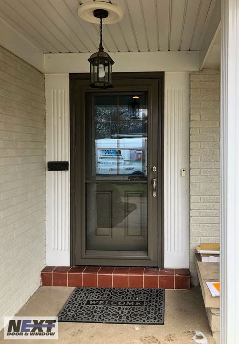 Customize your entryway with Next Door & Window. Shown here is a recently installed ProVia Signet entry door with a ProVia Spectrum storm door. https://nextdoorandwindow.com/ Front Storm Door Ideas, Larson Graphite Storm Door, Burgundy Storm Door, Door With Storm Door, Modern Storm Door With Screen, Almond Storm Door, Full Lite Storm Door, Grey Doors, Storm Door