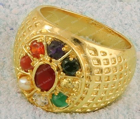 A "Navratna" ring, also known as a Navaratna or Nine-Gemstone ring, is a piece of jewelry that incorporates nine different gemstones, each representing one of the nine celestial bodies in Vedic astrology. The concept of the Navratna ring originates from ancient Indian astrology and is believed to bring astrological benefits and balance to the wearer. The nine gemstones typically included in a Navratna ring are: 1. Ruby (representing the Sun): Symbolizes power, leadership, and vitality. 2. Pearl Navaratna Ring, Navratna Ring, Indian Astrology, Vedic Astrology, Yellow Sapphire, Sapphire Gemstone, Gemstone Ring, Rings Statement, Handmade Ring