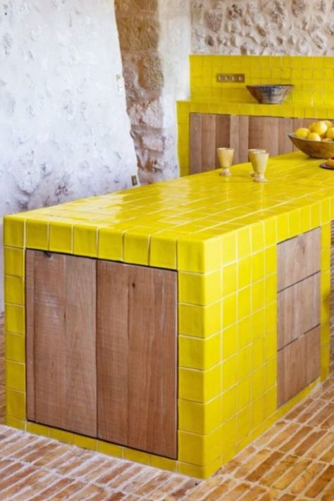 Acid Yellow glazed field tiles and special tiles featured in french kitchen island and kitchen backsplash. #newterracotta #glazedtiles #kitchendesign #yellow Yellow Tiled Kitchen, Tiled Kitchen Island, Yellow Tile Kitchen, Tile Kitchen Island, French Kitchen Island, Terracotta Kitchen Tiles, Mallorca House, Terracotta Kitchen, Sealing Grout