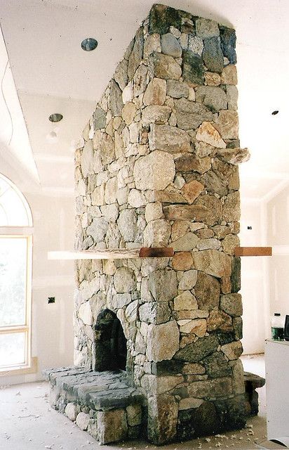 Double-sided stone fireplace - I want to find a house with one of these, would be perfect if the other side was in the kitchen. Two Sided Fireplace, Fireplace Designs, Double Sided Fireplace, Small Fireplace, Concrete Fireplace, Rock Fireplaces, Ski House, Fireplace Remodel, Home Fireplace