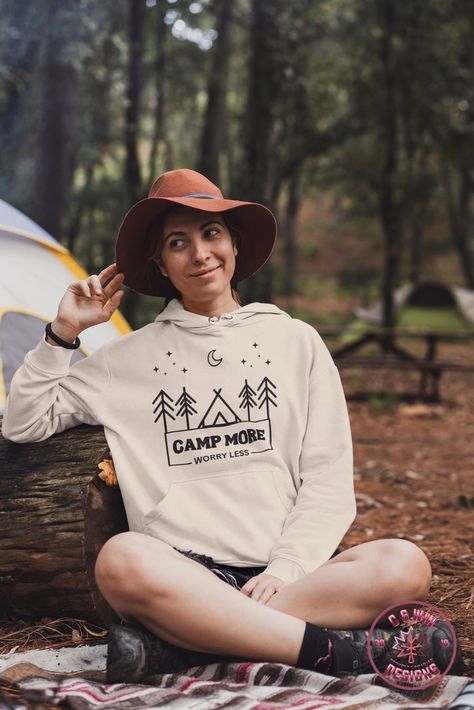 Introducing our gender neutral hoodie, perfect for all your outdoor adventures! Featuring a camping graphic and the uplifting phrase "Camp More Worry Less," this hoodie is both stylish and practical. Made with high-quality materials, it's soft, comfortable, and built to last. Whether you're hiking, camping, or just lounging around the campfire, this hoodie is the perfect addition to your wardrobe. Summer camping outfits, camping vibes, camping clothes Neutral Hoodie, Lets Get Drunk, Quote Travel, Uplifting Phrases, Camping Theme, Take A Hike, Neutral Design, Good Times Roll, Getting Drunk