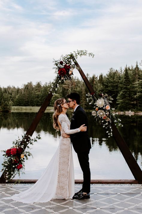 Our outdoor wedding ceremony was on a floating dock with a custom wooden triangle wedding arch for the backdrop, with big boho style flower arrangements on the ceremony arch.  See more of this sustainable Boho Vegan Wedding at Summer Solstice: http://www.confettidaydreams.com/sustainable-boho-vegan-wedding-at-summer-solstice/  #wedding #veganwedding #summerwedding #outdoorwedding #summersolstice #sustainablewedding #plasticfree #weddingideas #confettidaydreams #indiewedding Dock Wedding, Silver Wedding Decorations, Wedding Ceremony Ideas, Wedding Canopy, Vegan Wedding, Wedding Ceremony Arch, Rustic Wedding Inspiration, Wedding Ceremony Backdrop, Geometric Wedding