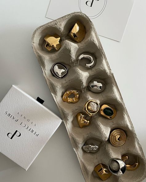 Golden weekend vibes: dazzling earrings on egg trays! #Jewelry #Jewellery #Gold #JewelryCollection #JewelleryCollection #GoldJewelry #GoldJewellery #JewelryAddict #JewelleryLover #GoldStyle #JewelryFashion #JewelleryDesign #GoldCollection #FineJewelry #LuxuryJewelry #JewelleryInspo #GoldAccessories #JewelryTrends #JewelleryLovers #GoldPieces #perfectpairs_jewels #perfectpairssydney #silverjewelry Jewelry Flatlay Aesthetic, Jewerly Packaging Creative, Jewelry Product Shots Ideas, Jewelry Ads Creative, Earring Product Photography, Jewellery Product Shoot, Jewelry Content Ideas, Jewelry Photo Ideas, Jewelry Marketing