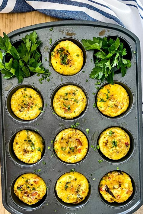 Here's an easy breakfast recipe to make a dozen scrambled egg cups all at the same time. These Muffin Tin Scrambled Eggs are quick to prepare and can even be made in advance. Tailor them to your personal tastes with your favorite vegetables, cheeses and/or bacon, ham or sausage. #muffinpaneggs #muffineggcups #easybreakfast #breakfastrecipe Egg Souffle Recipes Muffin Tin, Muffin Pan Eggs, Easy Egg Muffins, Muffin Pan Recipes, Baked Egg Cups, Eggs In Muffin Tin, Cheesy Mac And Cheese, Tin Recipes, Egg Omelet