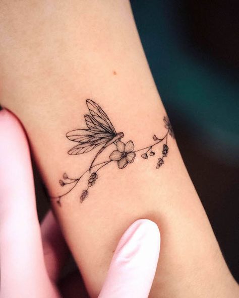 57 Stunning Dragonfly Tattoos With Meaning - Our Mindful Life Dragonfly Tattoos, Wrap Around Wrist Tattoos, Small Dragonfly Tattoo, Fineline Tattoos, Wrap Around Tattoo, Our Mindful Life, Flying Tattoo, Wrap Tattoo, Dragonfly Tattoo Design