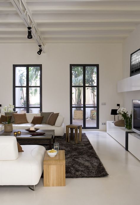 an apartment in barcelona | featured on my blog the style fi… | Flickr Smaller Houses, Framed Windows, Apartment Color Schemes, Living Room Arrangements, Black Living Room, White Interior Design, Room Black, Trendy Living Rooms, Concrete Floor