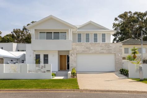 The Corlette House has been designed to fit comfortably within the surrounding context and is located within the popular holiday area of Port Stephens. Modern Costal Exteriors, Exterior Stone Wall Cladding, Coastal Home Exterior, Coastal Colours, Modern Mediterranean Homes, Port Stephens, Designing A Home, Gable House, Coastal Architecture