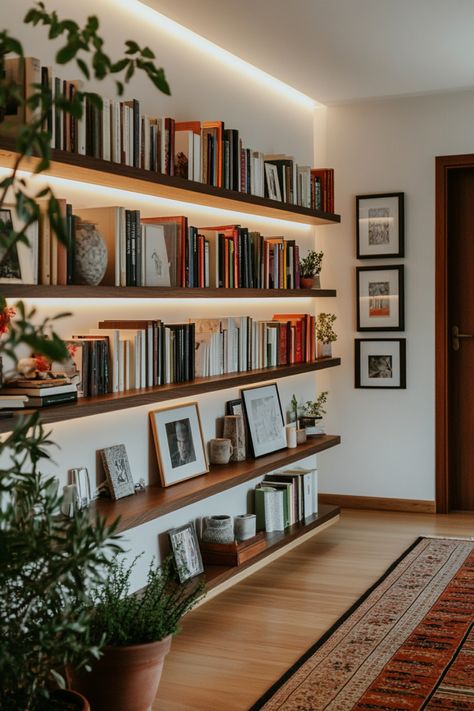 Turn your home office into a cozy home library with these tips and design ideas. Wall Shelf Library, Floating Shelves Library Bookshelves, Library Room Minimalist, Book Shelf Diy Wood, Simple Home Library Ideas, Midcentury Modern Library Room, Book Display Bedroom, Bright Home Library, Floating Shelf Library