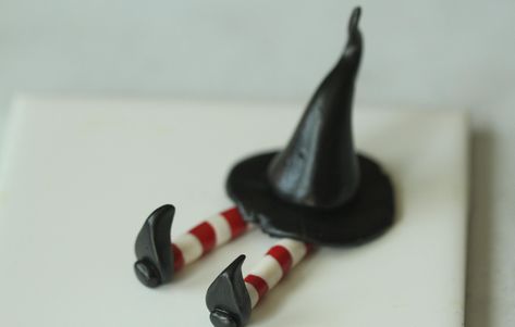 Little witch has tried to put on Mommy witch's hat and has gotten stuck under it. She has red and white stockings and black pointy witch shoes. All pieces are Handmade and may differ slightly from picture. Clay Witch, Witch Shoes, Diy Air Dry Clay, White Stockings, Witch Halloween, Affordable Home Decor, Pottery Ideas, Dry Clay, Diy Clay