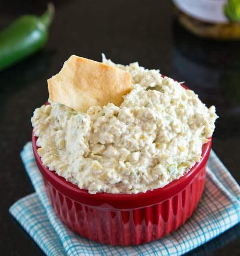 This artichoke and jalapeno dip is a copycat version of the creamy, spicy, and delicious Costco favorite. You can serve this cheese dip recipe warm or cold, and it's bound to be a hit. Artichoke Jalapeno Dip, Jalapeno Dip Recipes, Jalapeno Dip, Artichoke Dip Recipe, Snack Dip, Artichoke Dip, Yummy Dips, Mexican Dishes, Dip Recipes