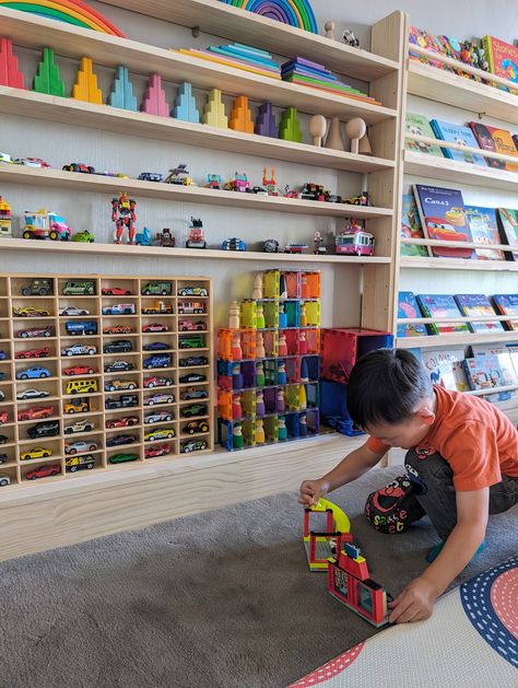 For displaying collection like wooden pegdolls, Hot Wheels and Pixar Cars, Matchbox cars (toy cars of scale 1:64) Designed with our Slim-line Toy shelf with 7 tier for the true enthusiast in mind, this display shelf offers a perfect blend of style and functionality. (Bottom tier) Spacious Design: Holds up to 60 Hot Wheels cars, giving each one a place of prominence. Durable Construction: Made from solid pine wood to ensure long-lasting use and stability. Sleek Aesthetic: With its modern design a Toy Car And Truck Organization, Lego Hobby Room, Hot Wheels Set Up, Toy Garage Diy, Hot Wheels Storage Ideas, Toys Organization Ideas, Hot Wheels Organization, Bonus Room Playroom, Lego Display Shelf