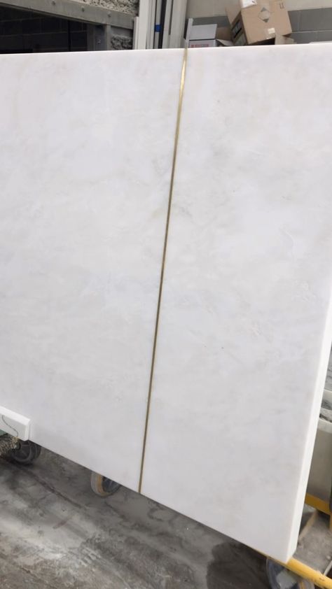 We love getting creative on oversized installs but seams always pose a challenge. Brass inlays are great example of ways to creatively mask a seam and add an additional layer of design into your counter tops when multiple slabs are required. #marble #marbles #stone #stones #tile #tiles #tiledesign #dreamhome #homedesign #homeideas #stoneslab #marblehome #marbledesign #luxurymarble #luxuryhome #marblestone #marbleslab #luxurystone #naturalmarble #interiordesign #interior #homeremodel #remodeling Countertop Inlay, Marble Countertop Edges, Kitchen Island Countertop Seam, Brass Strip Countertop, Brass Seam In Countertop, Brass Inlay Countertop, Brass Inlay Cabinet Doors, Brass Inlay Tile, Counter Extension