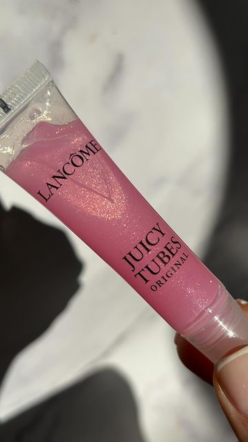 Naomi Mizrahi on Instagram: "So the juicy tube is going viral again… so excited to have this OG back in my life. How gorgg is this shade ?! @lancomeofficial juicy tube “miracle” RRP £25 FYI these glosses are a little sticky (I like this) but if you don’t like sticky this gloss isn’t for you. Please do not use/repost my content without my permission. - - - #lipgloss #viralmakeup #makeup #makeupmacro #makeupunboxing #newmakeup #makeupinspo #makeuplover #cleargloss #lipglossjunkie #lipglossaddict #plumpinggloss #lipplumper #glittergloss #sparkle #shimmergloss #ukblogger #ukinfluencer #ukmakeup #lancome #lancomejuicytubes #juicytube" Lancôme Juicy Tubes, Lancome Juicy Tubes Aesthetic, Juicy Tubes Lancome, Lancome Lip Gloss, Lancome Juicy Tubes, Tube Lip Gloss, Juicy Tubes, Glossy Lips Makeup, Uk Makeup