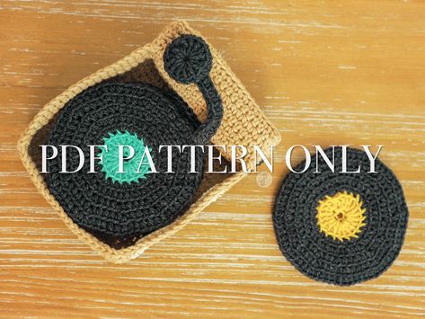 Spin Your Record Player Coasters is an advanced beginner crochet pattern to make a vinyl record player coaster set, life-size crochet vinyl's, vinyl purse, and vinyl cover. It is the perfect pattern for a beginner who is looking to advanced their crochet skills and knowledge! There are step-by-step photos where necessary, links to tutorials for beginners, and any helpful thoughts I could think of to help make this pattern easy to follow. Materials: 30-100yds of sport weight yarn 4.0mm crochet ho Crochet Record Player, Crochet Record Coasters, Crochet Vinyl Record, Whimsigoth Crochet, Crochet Room, Grandma Era, Crochet Cup Coaster, Coaster Patterns, Easy Beginner Crochet Patterns