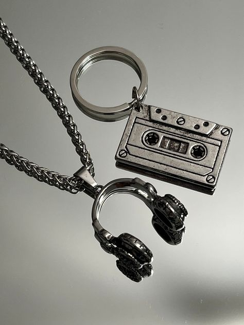 The ultimate present for him: A sleek Stainless Steel Vintage Cassette Keychain. Headphone pendant and 16" Chain option available.  Functional, Fashionable & Durable Men's Stainless Steel. Stainless Steel Vintage Cassette Keychain - Perfect Gift for the DJ, Musician, or Music Lover in your life. Amazing detail. Cassette  Length 1.5" Width 3/4" Headphone Length 1" Width 1" Chain 16" 3mm Whether you are buying for yourself or the man/woman in your life, this is going to be the piece that you/he/sh Dj Gifts For Men, Guy Keychain Ideas, Is This Love, Gifts For Musicians Boyfriend, Cool Key Chains, Masc Jewelry, Skateboard Jewelry, Musical Earrings, Cool Stuff For Men