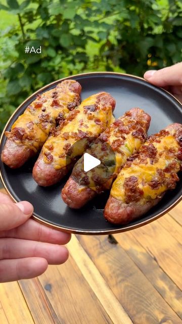 Tom Judkins | The Backyard Palate on Instagram: "#ad Smoked Brat Boats will sail you to flavor island using Kinder’s Creamy Honey Mustard Sauce and Woodfire Garlic seasoning. Great Labor Day idea, absolutely delicious and so easy🔥
•
INGREDIENTS:
5 pack brat sausages
8oz cream cheese
@kindersflavors Woodfire Garlic Seasoning
Diced poblano peppers
@kindersflavors Creamy Honey Mustard Dipping Sauce
Shredded Colby Jack cheese
Bacon pieces
•
INSTRUCTIONS:
-Preheat smoker to 275F and slice sausages down the middle to create room for cream cheese filling. 
-Place in cream cheese, seasoning with Woodfire Garlic, then top with poblano peppers, Creamy Honey Mustard, Colby Jack cheese, and bacon.
-Smoke for about 45 minutes and slice in half. So simple and so delicious!
•
Check out the discount in m Stuffed Brats With Cream Cheese, Smoked Sausage Boats, Sausage And Bacon Recipes, Cheese Stuffed Brats, Stuffed Brats, Grilling Brats, Smoked Brats, Creamy Honey Mustard, Brat Sausage