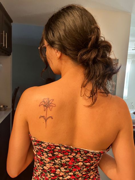 this is MY tattoo on MY body, work done by @/cochino08 on insta !! follow @hervisualflow on insta as well :) Fine Line Tiger Lily Tattoo, Flower Tattoo On Back Shoulder, Lily Flower Tattoos Shoulder, Flower Lily Tattoo, Shoulder Tattoo Placement, Lily Shoulder Tattoo, Easter Lily Tattoo, Flower Back Tattoos, Lily Tattoos For Women