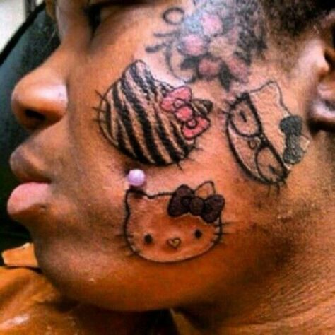 She really loves hello kitty... She'll never get a job! Tatuaje Hello Kitty, Black People Tattoos, Cheek Piercings, Horrible Tattoos, Hello Kitty Face, Hello Kitty Tattoos, Tattoo Fails, Mandalas Painting, Bad Tattoos