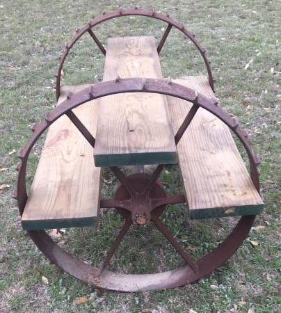 Metal Wagon Wheel Decor Outdoor Garden, Decorating With Wagon Wheels, Wagon Wheel Table Diy, Old Wagon Wheel Garden Ideas, Wagon Wheel Address Sign, Wagon Wheel Trellis, Painted Wagon Wheel, Tractor Wheel Ideas, Old Wheels In Garden