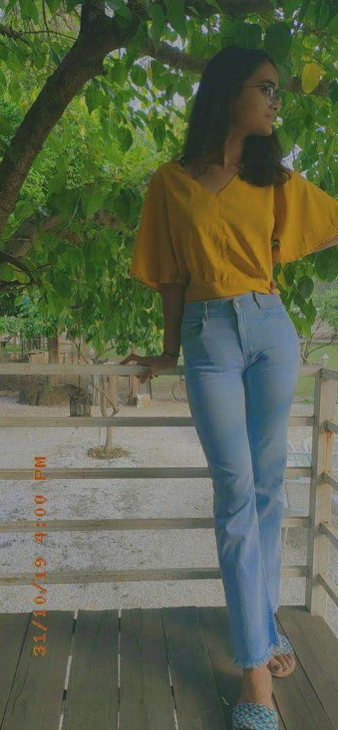 Elegant and sleeky look with bell bottom and a mustard top #bellbottoms #pose #westernoutfit Mustard Top, Bottom Jeans, Bell Bottom, Western Outfits, Bell Bottoms, Bell Bottom Jeans, Mustard, Mom Jeans, Pants