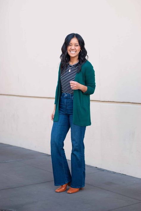 green cardigan + black and white striped long sleeve top + flare jeans + cognac boots Green V Neck Sweater Outfit, Green Cardigan Outfit, Dark Green Cardigan, Winter Cardigan Outfit, Nursing Friendly Outfits, Olive Green Shirt, Cognac Boots, Striped Long Sleeve Tee, Green Cardigan