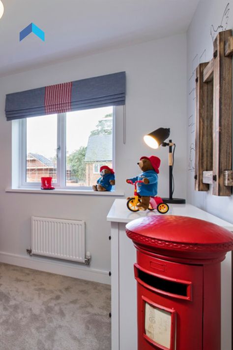 This is such a cute London themed kids bedroom. The matching red and blues really make the room pop, and we love the addition of Paddington Bear across the whole room; how many can you spot? With the addition of the postbox bookshelf and wooden detailing, it's perfect for any child! Paddington Bedroom Ideas, Paddington Bear Bedroom, Paddington Bedroom, Paddington Nursery, Bus Bedroom, London Nursery, London Decor, London Bedroom, Vintage Kids Room