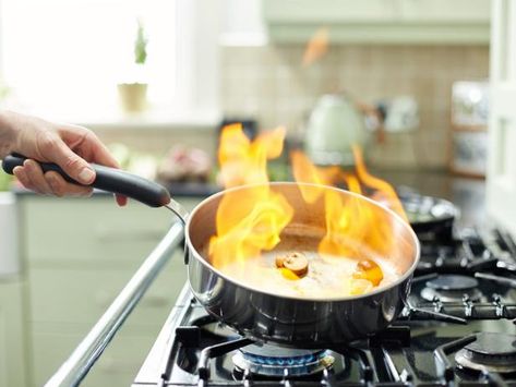 Rule No. 1 when fighting a grease fire: NEVER use water. It will only spread the fire and make it worse. Instead, douse the flames with salt. Also effective: throwing on baking soda, covering the fire with a lid to cut off the oxygen and (of course) using a fire extinguisher. Photo: Neustockimages/iStock The Kitchen Food Network, Stove Top Oven, Fire Food, Baking Basics, Perfect Chicken, Kitchen Counter Decor, Grease Stains, Stainless Steel Cookware, Kitchen Stories