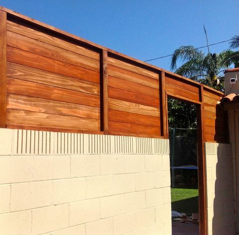 5 Most Important Reasons Why You Should Get Cinder Block and Wood Fence Cinder Block And Wood Fence, Cinder Block Wall Painting Ideas, Block Wall Painting Ideas, Cinder Block Garden Wall, Fence Paint Colours, Modern Wood Fence, Wall Pergola, Wall Stains, Peach Garden