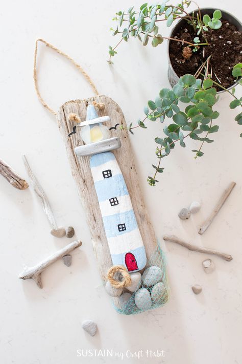 This driftwood craft idea brings out the best part of a nautical theme. Not only are you using driftwood, but there is a cute lighthouse too! Lighthouse Craft, Diy Lighthouse, Diy Nautical Decor, Lighthouse Crafts, Diy Nautical, Candy Corn Decorations, Beach Themed Crafts, Diy Beach Decor, Painted Driftwood