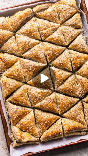 Erin || Recipe Developer 📸 on Instagram: "This is such an easy dish to make in honor of Purim!   Inspired by @sivanskitchen I decided to make sheet pan bourekas in the shape of triangles.   Details ⬇️  Sheet Pan Hamentaschen Bourekas @erin.eats.mtl   Ingredients: Puff pastry  Filling - I used a mixture of 16oz mushrooms sautéed, 2 sautéed shallots, 1 bag chestnuts and about 3/4 cup pesto) 1 egg  Sesame seeds (or you can use turbinado sugar if you’re filling with something sweet)   Directions: 1) Preheat oven to 375°F.   2) Place a sheet of puff pastry on floured parchment. Roll out slightly.   3) Top with filling of choice.   4) Top with another sheet of puff pastry.   5) Cut as pictured in video - I divided the dough into 4 sections and cut each into triangle. If you are nervous to do it Puff Pastry Triangles, Puff Pastry Shaping Ideas, Puff Pastry Shapes Ideas, Spanakopita Triangles, Puff Pastry Cupcake Pan, Spanakopita Puff Pastry Swirls, Tofu Puff Pastry, Catering Buffet, Puff Pastry Filling