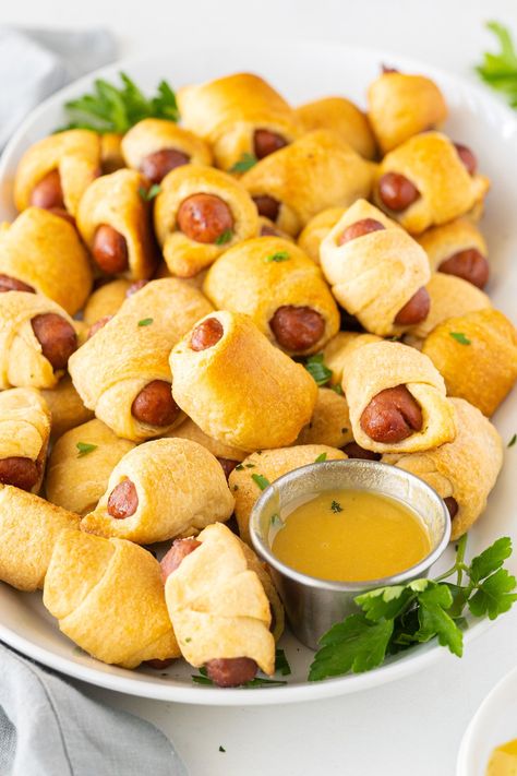 How to make classic pigs in a blanket, everyone's favorite party appetizer! Use cocktail wieners or sliced hot dogs for the kids. Hot Dog Appetizers, Cocktail Wieners, Favorite Party Appetizers, Sausage Appetizers, Cocktail Sausages, Bacon Deviled Eggs, Delicious Appetizer Recipes, Honey Mustard Sauce, Pigs In A Blanket