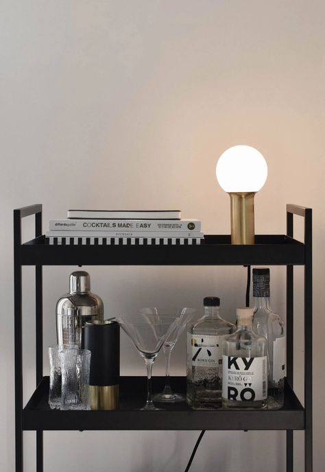 Minimalist brass table lamp on our bar cart #LEDlighting #minimalistlighting #scandinavianinteriors #barcart #homebar Bar Trolley Styling, Small Bar Cart, Apartment Decorating Black, Black Bar Cart, Minimalist Sideboard, Home Bar Table, Solid Oak Sideboard, Apartment Bar, Modern Bar Cart