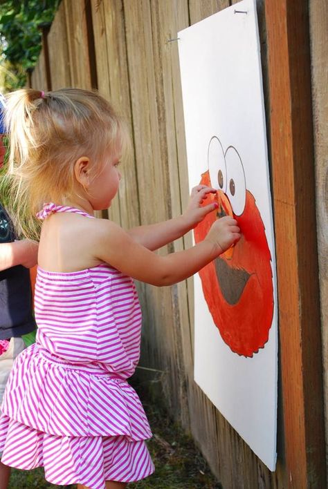 Pin the nose on Elmo.  Elmo birthday @Megan Ward McDonald I don't know if Lynzy is old enough for this Elmo Snacks, Megan Ward, Elmo And Friends, Cookie Monster Birthday, Elmo Birthday Party, Sesame Street Birthday Party, Elmo Party, Sesame Street Party, Elmo Birthday