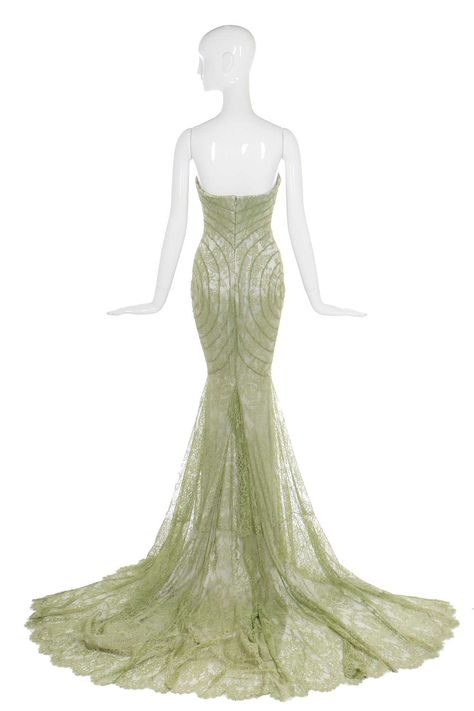 Givenchy haute couture by Alexander McQueen green lace evening gown, 'Eclect-Dissect', A/W 1997-98 bearing défilé label, handwritten 'AH97.Shirley, 17', the strapless bodice with internal tulle corset, silver-grey satin under-dress with trained hem, the pale-green bias-cut ace bands joined to follow the curves of the body, bust 81cm, 32in This was the only garment McQueen retained from his time at Givenchy. Annabelle was photographed wearing this dress to the 'Black Art and Fashion' charity au Corset Green Dress, Alexander Mcqueen Green, Lee Mcqueen, Givenchy Haute Couture, Tulle Corset, Lace Evening Gowns, Under Dress, Green Lace, Pale Green