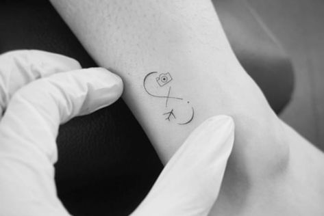 160+ Infinity Tattoo With Names, Dates, Symbols And More (For Women) Infinity Tattoo With Names, Infinity Name Tattoo, Tattoo With Names, Small Infinity Tattoos, Wrist Tatoo, Minnie Tattoo, Baby Memorial Tattoos, Infinity Tattoo With Feather, Infinity Tattoo On Wrist