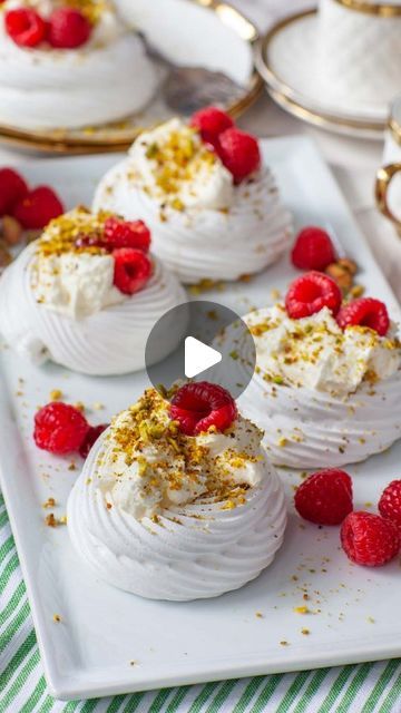 Tatyana Nesteruk on Instagram: "Perfect for Easter! Mini Pistachio & Raspberry Pavlovas - delicate clouds of sweet meringue mixed with salted pistachios, a dollop of raspberry preserves, and whipped cream on top! The outside is crispy and crunchy, while the inside is soft and fluffy! 

Get all the recipe details and watch my full-length video tutorial on my website, link in profile @tatyanaseverydayfood  Plus, get more Easter recipe ideas! 

#baking #pavlova #recipe #desserts #bakefeed #bakersofinstagram #minipavlova #Easter #easterdessert #pistachio #raspberry #driscollsberries #delicious #minidesserts #foodnetwork #mywilliamssonoma #tasty #thekitchn #f52grams #beautifulcuisines #eat #foodie #tatyanaseverydayfood" Mini Pavlova Ideas, Recipe Ideas Baking, Driscolls Berries, Pistachio Raspberry, Mini Pavlova, Easter Recipe, Pavlova Recipe, Raspberry Preserves, Easter Dessert