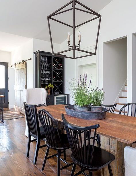 In this circa-1845 house, the harvest table is a custom design. Designer Susan Burns used red pine reclaimed in the attic during the renovation for the top, which gives it a historic, authentic touch. | Photographer: Robin Stubbert | Designer: Susan Burns Harvest Table Dining Room, Floral Accent Chairs, Mismatched Dining Chairs, Fall Meal, Woven Dining Chairs, Table Dining Room, Farmhouse Tables, Formal Dining Set, Heritage House