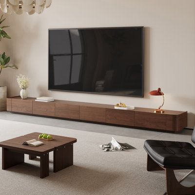 Escape into refined luxury with our exquisite brown TV cabinet, a sanctuary that seamlessly blends into your living space, enhancing both aesthetics and daily living. Latitude Run® | Latitude Run® Ayrah Modern 133.86"Mid Century TV Stands,6 Drawers, Solid Wood in Brown | 88" | Wayfair Minimal Media Console, Mid Century Tv Stands, Aesthetic Tv Unit, Wall Mount Tv Stand, Midcentury Tv Stand, Mid Century Tv, Oak Tv Unit, Wood Media Console, Mid Century Modern Tv Stand