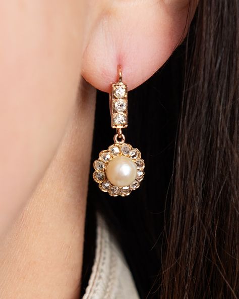 𝑾𝒆𝒂𝒓𝒂𝒃𝒍𝒆 𝒉𝒊𝒔𝒕𝒐𝒓𝒚. Sure to elevate any ensemble, these stunning antique earrings are a true work of art. Circa 1890, the intricate craftsmanship reflects the bespoke elegance of the Victorian era. A lustrous pearl as the centrepiece is delicately cradled by sparkling diamonds and a captivating set top bar that will add a touch of vintage glamour to any occasion. Should you share our passion for fine jewellery, we'd love to invite you to explore our stunning vintage and moderne collections o... Victorian Jewelry Earrings, Luxury Victorian Pearl Earrings For Pierced Ears, Victorian Pearl Earrings For Wedding, Victorian Style Handmade Gold Pearl Earrings, Luxury Victorian Drop Earrings, Luxury Victorian Pearl Earrings, 3 Earrings, The Victorian Era, Vintage Jewlery