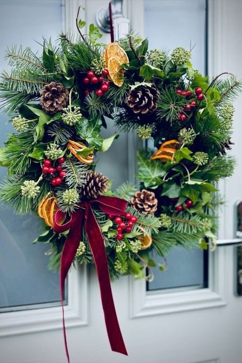 A smaller wreath but just as beautiful. Set on a 30cm frame with firs and Ivy and berries  Sliced oranges and Ivy Finished with a red velvet bow  If you spray with water this will last till the new year  these will be dispatched November and or if you want earlier message me Real Wreath, Ivy Berries, Real Christmas Wreaths, Christmas Reef, Homemade Christmas Wreaths, Velvet Ribbon Bow, Natural Christmas Wreaths, Fresh Christmas Wreath, Red Velvet Ribbon