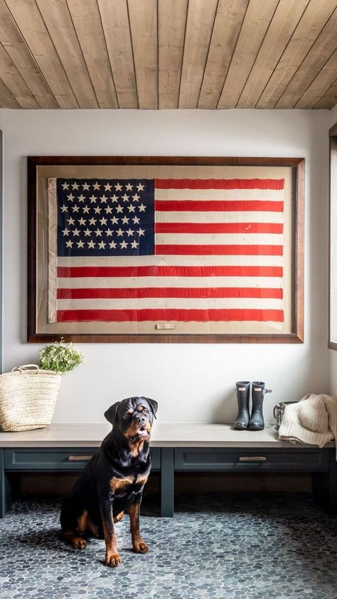 Framed American Flag In Living Room, American Flag Home Decor, American Flag Interior Design, Americana Lake House, Framed Flag Decor, Patriotic Interior Design, American Flag Entry Way, Framed American Flag Vintage, American Flag In Bedroom