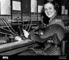 1930s WOMAN TELEPHONE OPERATOR AT SWITCHBOARD LOOKING AT CAMERA SMILING Stock Photo - Alamy 1930s Woman, Telephone Operator, English German, Vintage Telephone, Sitges, North London, Image Processing, Photos Of Women, Antalya