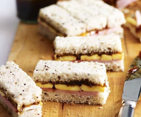 With the addition of caramelised onion relish, these ham and cheese finger sandwiches make the tastiest afternoon snack. You can experiment with all sorts of fillings like smoked salmon with cream cheese, egg and mayo, or chicken and watercress. Turkey Brie Sandwich, Salmon With Cream Cheese, Appetizers Puff Pastry, High Tea Sandwiches, English High Tea, Brie Sandwich, Chocolate Ganache Tart, Tea Sandwich, Sandwich Fillers