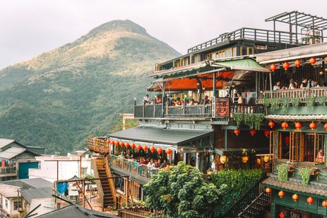 Exploring the mountain town of Jiufen in Taiwan (east of Taipei) feels a little like being in a fantasy movie – its ancient and narrow streets, packed full of beautiful tea-houses and street-food stalls, set amidst a backdrop of stunning coastal views almost feels unreal. In fact, legend has it that Jiufen was the inspiration behind the setting for the classic animated Studio Ghibli movie, Spirited Away (although many dispute this so who knows?!). A visit to Jiufen should be high on your list Dunedin New Zealand, Malaysia Itinerary, Taipei Travel, Petronas Towers, Cameron Highlands, Mountain Town, Island Hopping, New Zealand Travel, Portugal Travel