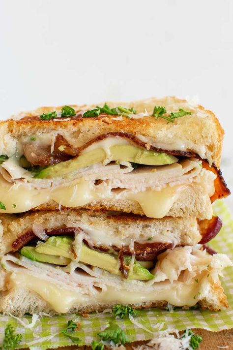 The best turkey sandwich -grilled with bacon and avocado. Plus 10 ideas of what to put on turkey sandwiches. Everything from a classic turkey sandwich, a turkey sandwich with cranberries, and with Thanksgiving leftovers. We like to call them turkey melts, or grilled turkey cheese sandwiches! Turkey Gobbler Sandwich, Fancy Turkey Sandwiches, Turkey Swiss Sandwich, Sandwich Rollups, Turkey Sandwich Ideas, Turkey Supreme, Turkey Melt Sandwich, Turkey Breast Sandwich, Turkey Melts