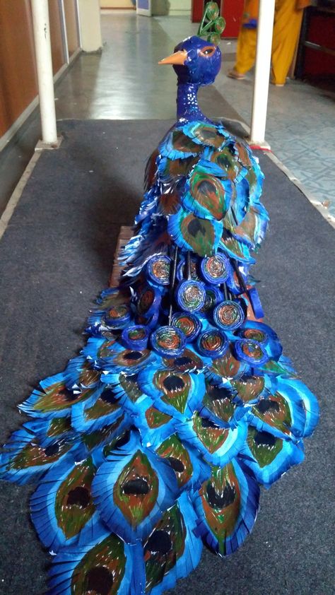 This peacock is made up of waste newspapers, glue , tape, and colour. Peacock Fancy Dress, Fancy Dress Diy, Custom Halloween Costumes, Recycled Costumes, Frock Models, Tree Costume, Peacock Costume, Paper Mache Projects, Recycled Dress