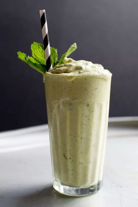 This chilly treat is an adaptation of one served at the Royale Eatery, a burger and shake shop in Cape Town, South Africa. A simple purée of avocado, ice cream, mint leaves, and ice, it's sweet, rich, and dense enough to stand a spoon in. Homemade Milkshake Recipe, Best Avocado Recipes, Mint Milkshake, Avocado Shake, Homemade Milkshake, Mint Shake, Burgers And Shakes, Avocado Ice Cream, Milkshake Recipes