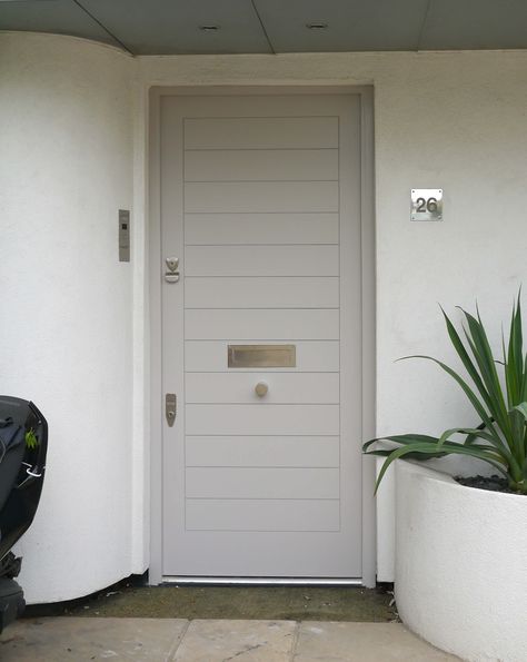 Grey Contemporary Front Door. Cool and uncompromising, these doors have been finished in a modern, neutral tone and enhanced with chrome door furniture. Light Grey Front Door, Cream Colored Houses, Curved Architecture, Grey Front Door, Door Colour, Garage Door Types, Kerb Appeal, Porch Door, Modern Doors